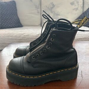 Dr. Martens Black Leather Platform Combat Boots with Yellow Stitching